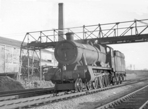 1964: Past the brickworks (off New Street), showing the aerial ropeway which crossed the railway at this point on a gantry, and which conveyed clay from the claypits :  : 